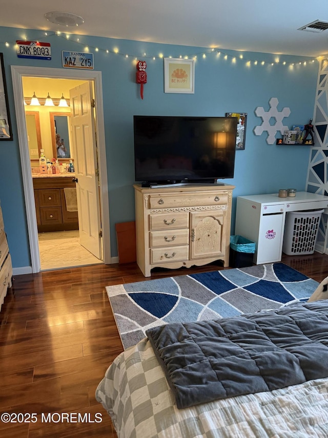 300 Allenhurst Ave, Neptune Township, NJ 07753 - bedroom with wood finished floors, ensuite bath, and baseboards