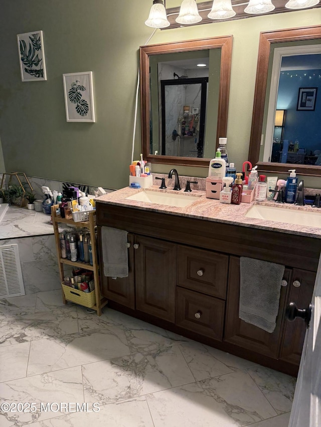 300 Allenhurst Ave, Neptune Township, NJ 07753 - bathroom featuring marble look tile flooring and double vanity