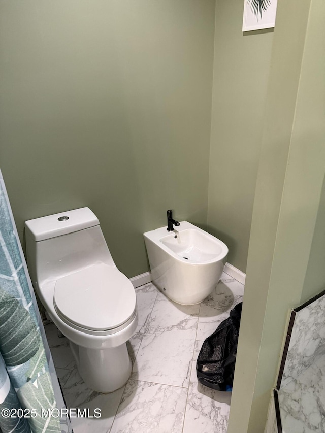 300 Allenhurst Ave, Neptune Township, NJ 07753 - bathroom with marble look tile flooring, a bidet, toilet, and baseboards