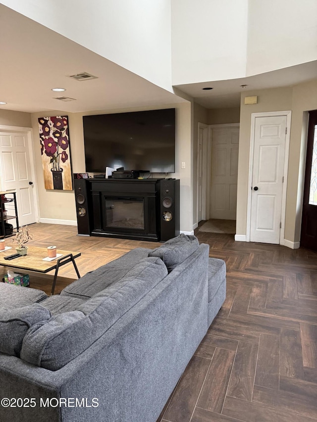 300 Allenhurst Ave, Neptune Township, NJ 07753 - living room with baseboards, a glass covered fireplace, recessed lighting, and a high ceiling