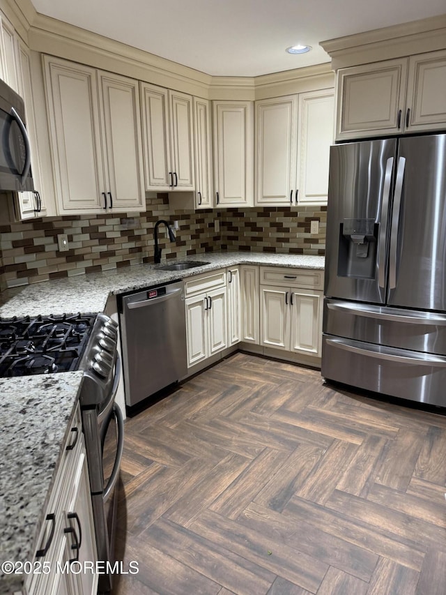 300 Allenhurst Ave, Neptune Township, NJ 07753 - kitchen with appliances with stainless steel finishes, a sink, recessed lighting, backsplash, and light stone counters