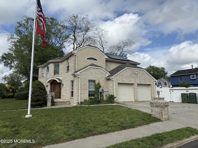 300 Allenhurst Ave, Neptune Township, NJ 07753 - view of front of property featuring solar panels, concrete driveway, brick siding, and a gate