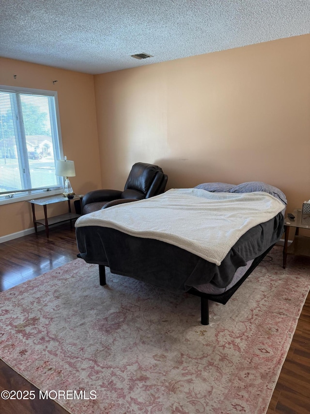 300 Allenhurst Ave, Neptune Township, NJ 07753 - bedroom featuring wood finished floors, a textured ceiling, and baseboards