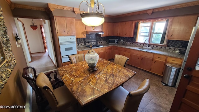 354 Alpine St, Perth Amboy City, NJ 08861 - kitchen with appliances with stainless steel finishes, backsplash, a warming drawer, and under cabinet range hood