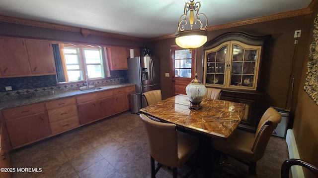 354 Alpine St, Perth Amboy City, NJ 08861 - kitchen with plenty of natural light, stainless steel fridge, backsplash, and hanging light fixtures
