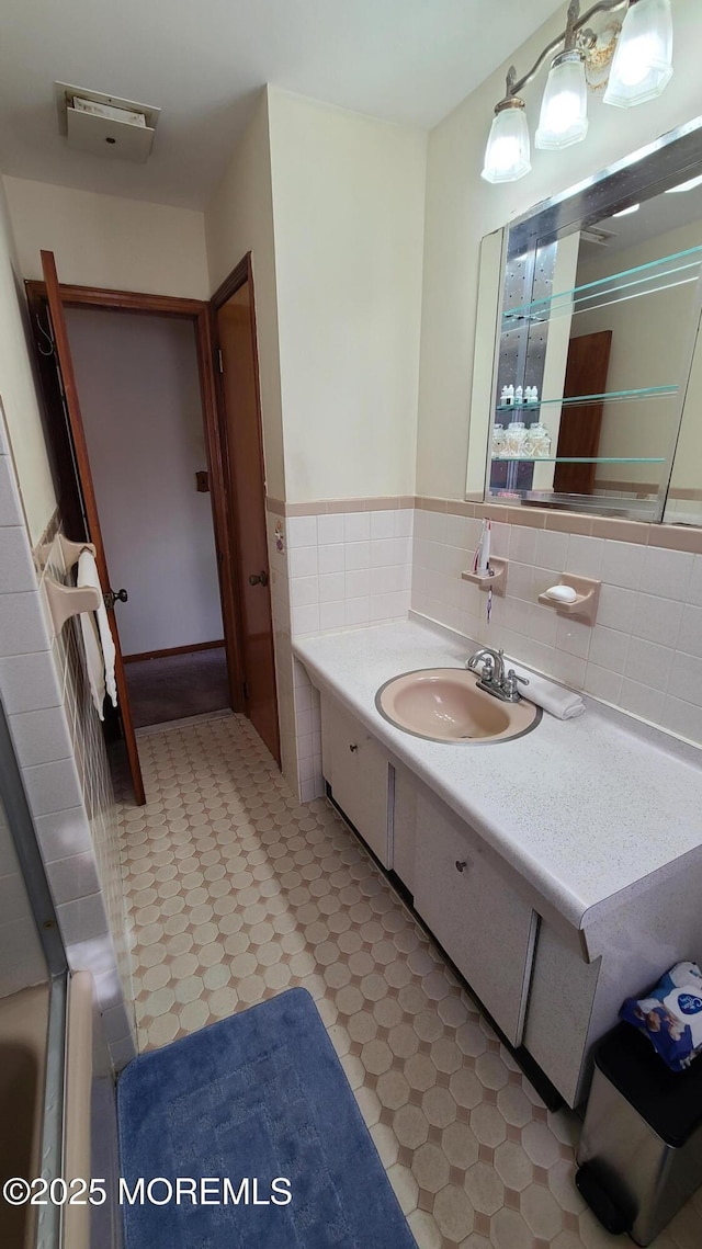354 Alpine St, Perth Amboy City, NJ 08861 - full bathroom with tile patterned floors, vanity, a tub, wainscoting, and tile walls