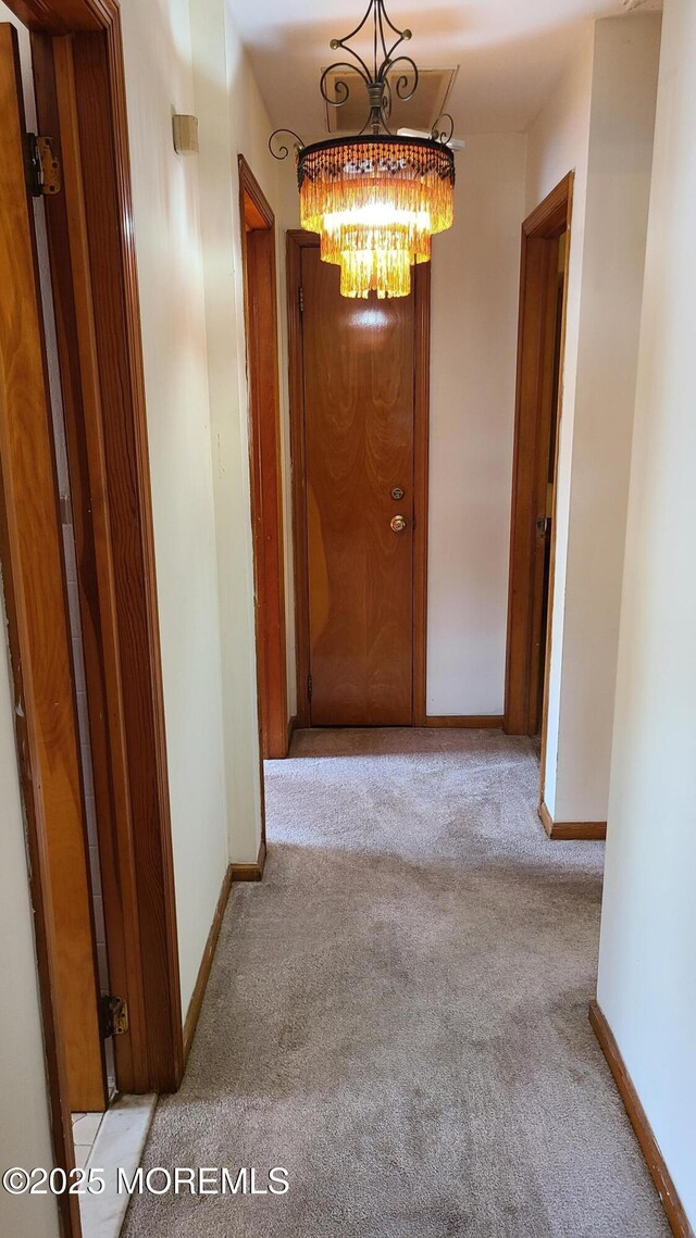 354 Alpine St, Perth Amboy City, NJ 08861 - corridor with carpet floors and a chandelier