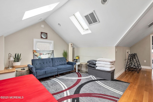 51 Oakland St, Red Bank, NJ 07701 - living area featuring a skylight, wood finished floors, lofted ceiling, and baseboards