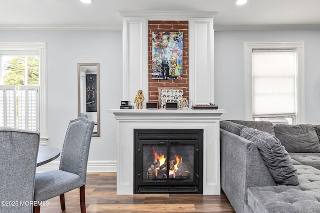 51 Oakland St, Red Bank, NJ 07701 - living area featuring wood finished floors, recessed lighting, a glass covered fireplace, crown molding, and baseboards