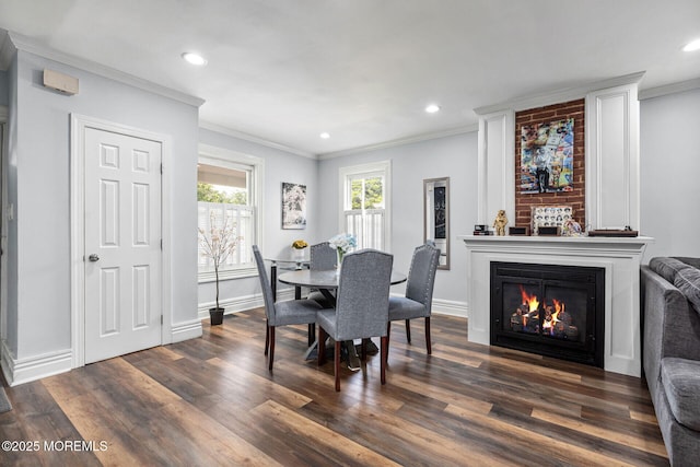 51 Oakland St, Red Bank, NJ 07701 - dining area with ornamental molding, dark wood-type flooring, a large fireplace, baseboards, and recessed lighting