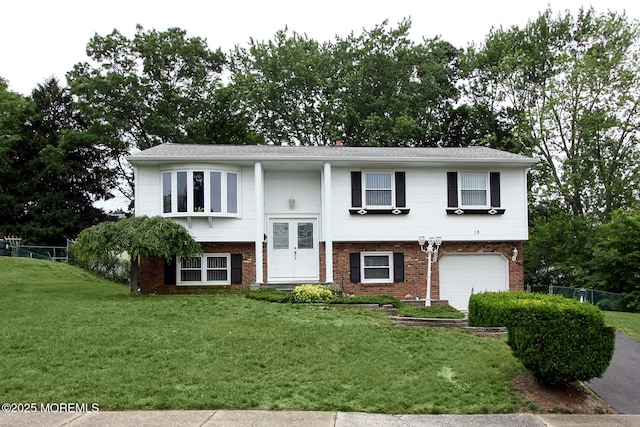18 Kingsport Dr, Howell, NJ 07731 - bi-level home with a garage and brick siding