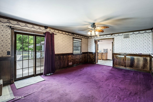 66 Cedar Swamp Rd, Jackson, NJ 08527 - carpeted empty room with wallpapered walls, a wainscoted wall, plenty of natural light, and ceiling fan