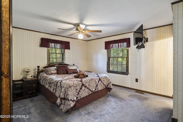 66 Cedar Swamp Rd, Jackson, NJ 08527 - carpeted bedroom featuring multiple windows, ornamental molding, ceiling fan, and wallpapered walls