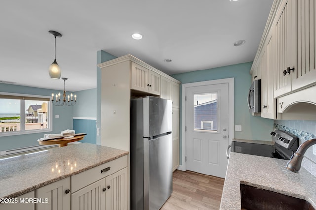 233 Heron Rd, Tuckerton, NJ 08087 - kitchen featuring appliances with stainless steel finishes, a sink, plenty of natural light, light wood-style flooring, and recessed lighting