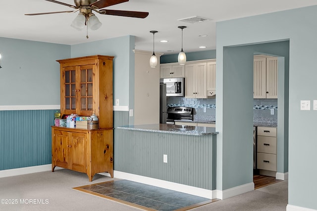233 Heron Rd, Tuckerton, NJ 08087 - kitchen with appliances with stainless steel finishes, a ceiling fan, light colored carpet, tasteful backsplash, and white cabinets