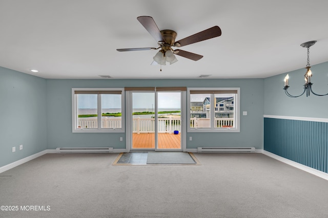 233 Heron Rd, Tuckerton, NJ 08087 - spare room with baseboard heating, a chandelier, carpet flooring, and ceiling fan