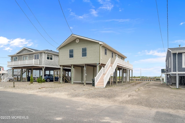 233 Heron Rd, Tuckerton, NJ 08087 - rear view of house with stairs, a carport, and driveway