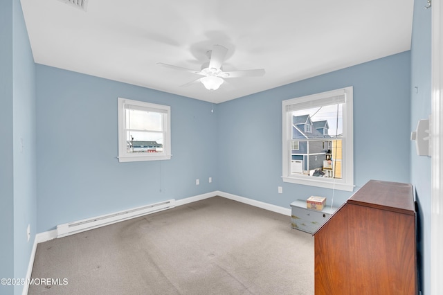 233 Heron Rd, Tuckerton, NJ 08087 - unfurnished bedroom with baseboard heating, carpet, baseboards, and multiple windows