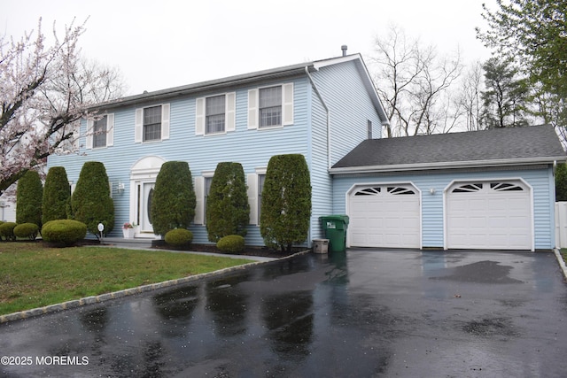 4 Hemlock Hill Rd, Jackson, NJ 08527 - colonial house with asphalt driveway, an attached garage, and a front yard
