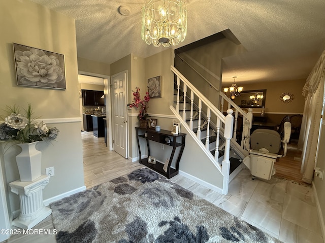 4 Hemlock Hill Rd, Jackson, NJ 08527 - foyer entrance with a chandelier, a textured ceiling, stairs, and baseboards