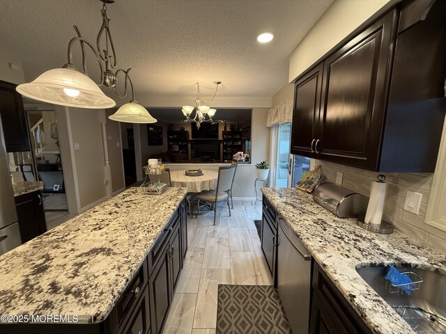 4 Hemlock Hill Rd, Jackson, NJ 08527 - kitchen with a chandelier, a textured ceiling, backsplash, light stone countertops, and recessed lighting