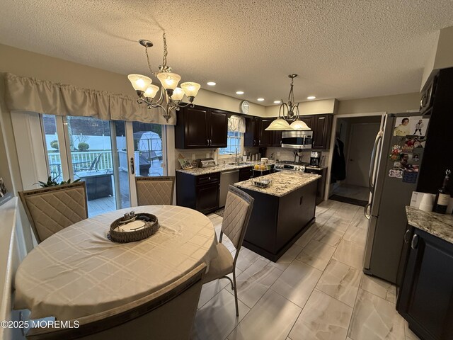 4 Hemlock Hill Rd, Jackson, NJ 08527 - kitchen with appliances with stainless steel finishes, a kitchen island, plenty of natural light, a chandelier, and recessed lighting