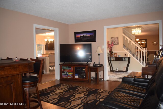 4 Hemlock Hill Rd, Jackson, NJ 08527 - living area featuring a chandelier, stairs, wood finished floors, and a textured ceiling