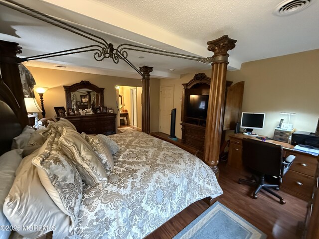4 Hemlock Hill Rd, Jackson, NJ 08527 - bedroom featuring ornate columns, wood finished floors, an office area, and a textured ceiling