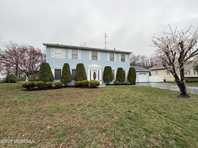 4 Hemlock Hill Rd, Jackson, NJ 08527 - colonial home with driveway, a front yard, and a detached garage