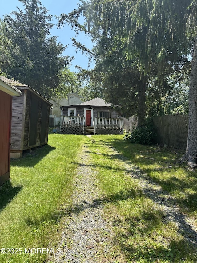 122 Hamilton Ave, Leonardo, NJ 07737 - view of yard featuring a deck and a storage shed