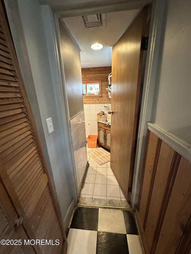 122 Hamilton Ave, Leonardo, NJ 07737 - hallway with tile walls and wainscoting