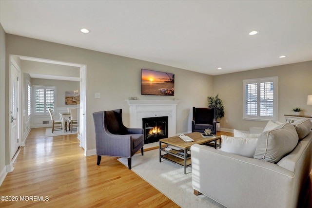 206 Chicago Ave, Point Pleasant Beach, NJ 08742 - living area with a lit fireplace, light wood-type flooring, recessed lighting, and baseboards