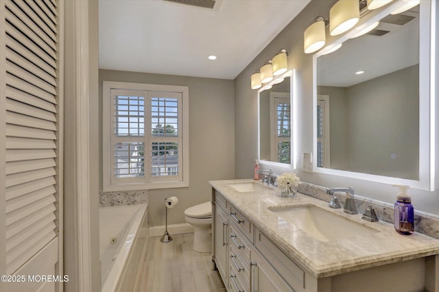 206 Chicago Ave, Point Pleasant Beach, NJ 08742 - full bath with double vanity, baseboards, a whirlpool tub, toilet, and recessed lighting