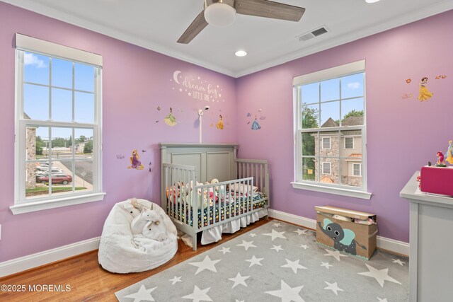 38 Phillip E Frank Way Unit 38, Cliffwood, NJ 07721 - bedroom featuring a nursery area, ornamental molding, wood finished floors, recessed lighting, and ceiling fan