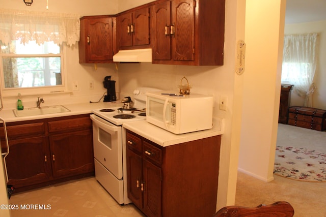 32C Yorktown Pkwy Unit C, Whiting, NJ 08759 - kitchen with white appliances, custom exhaust hood, light carpet, and light countertops
