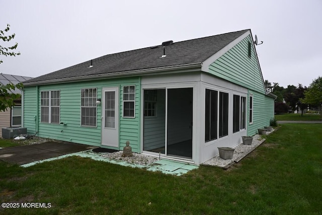 22 Elmswell Ave, Manchester, NJ 08759 - rear view of house featuring a lawn and a shingled roof