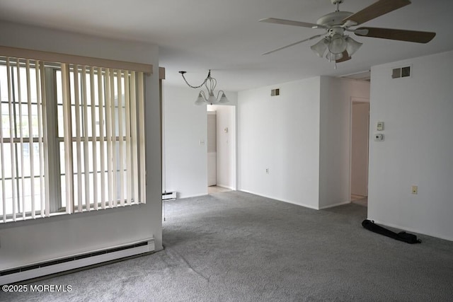 22 Elmswell Ave, Manchester, NJ 08759 - carpeted empty room featuring a baseboard heating unit, a chandelier, a ceiling fan, and baseboard heating