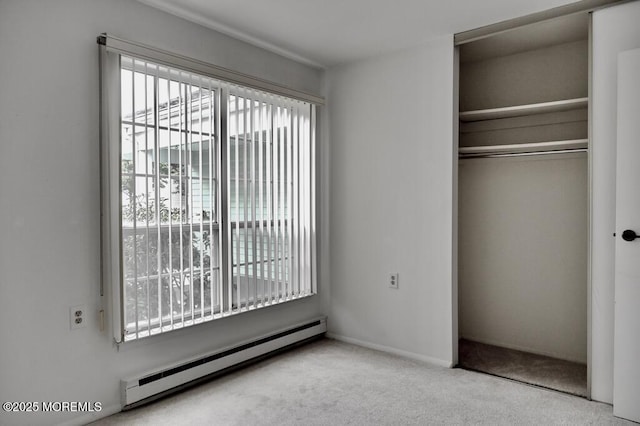 22 Elmswell Ave, Manchester, NJ 08759 - unfurnished bedroom featuring baseboard heating, a closet, and carpet