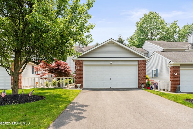 74 Mc Kinley Dr, Ocean Twp, NJ 07712 - view of front of property featuring brick siding and driveway