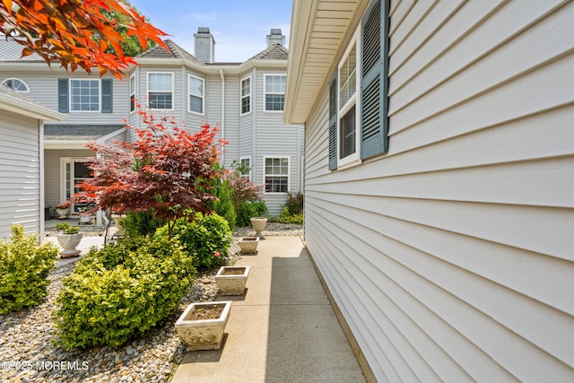 74 Mc Kinley Dr, Ocean Twp, NJ 07712 - view of property exterior with a chimney