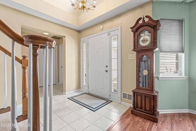 74 Mc Kinley Dr, Ocean Twp, NJ 07712 - foyer entrance featuring a chandelier, stairs, and light tile patterned flooring