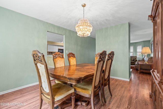 74 Mc Kinley Dr, Ocean Twp, NJ 07712 - dining area with a chandelier and wood finished floors