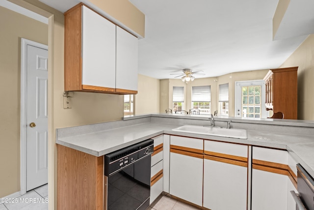 74 Mc Kinley Dr, Ocean Twp, NJ 07712 - kitchen with dishwasher, light tile patterned floors, light countertops, and white cabinetry