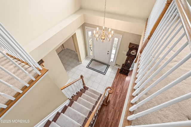 74 Mc Kinley Dr, Ocean Twp, NJ 07712 - foyer entrance featuring stairs and a chandelier