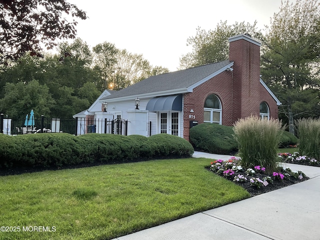 74 Mc Kinley Dr, Ocean Twp, NJ 07712 - view of front facade featuring a chimney, brick siding, and a shingled roof
