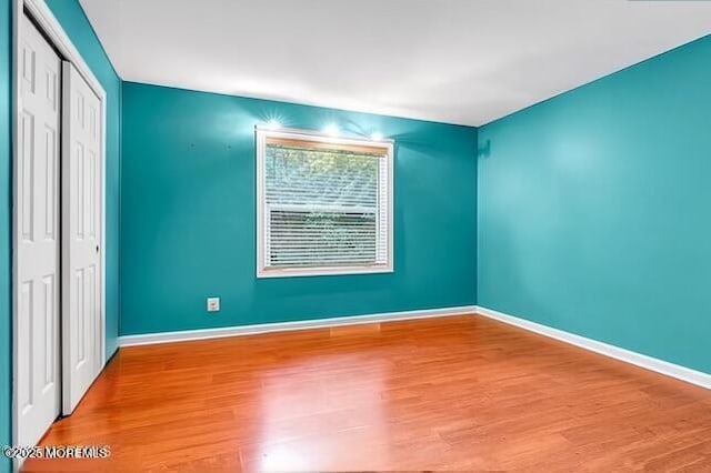 532 Georgia Tavern Rd, Howell, NJ 07731 - unfurnished bedroom featuring wood finished floors and a closet