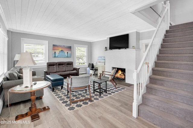 342 Lincoln Ave, Avon-By-The-Sea, NJ 07717 - living room featuring wood finished floors, stairs, a fireplace with flush hearth, wood ceiling, and ornamental molding