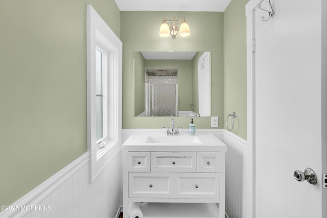 342 Lincoln Ave, Avon-By-The-Sea, NJ 07717 - bathroom with vanity, a tile shower, a chandelier, and wainscoting
