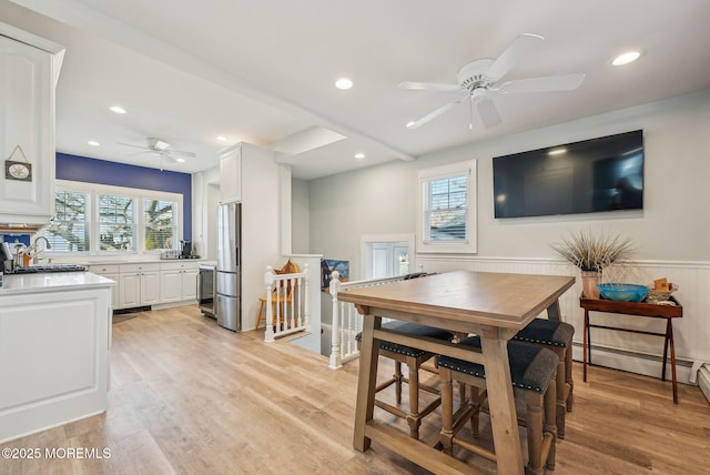 342 Lincoln Ave, Avon-By-The-Sea, NJ 07717 - dining space with ceiling fan, recessed lighting, light wood-style flooring, a wainscoted wall, and baseboard heating