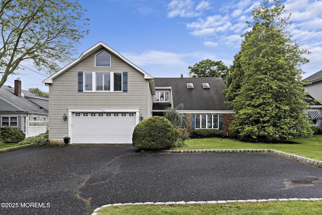 14 W St, Monmouth Beach, NJ 07750 - traditional home with asphalt driveway, a garage, and a front yard